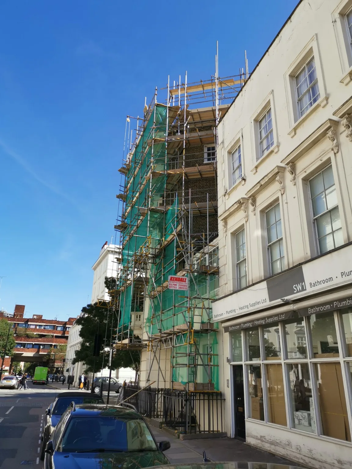 Scaffold with protective sheeting on a London street