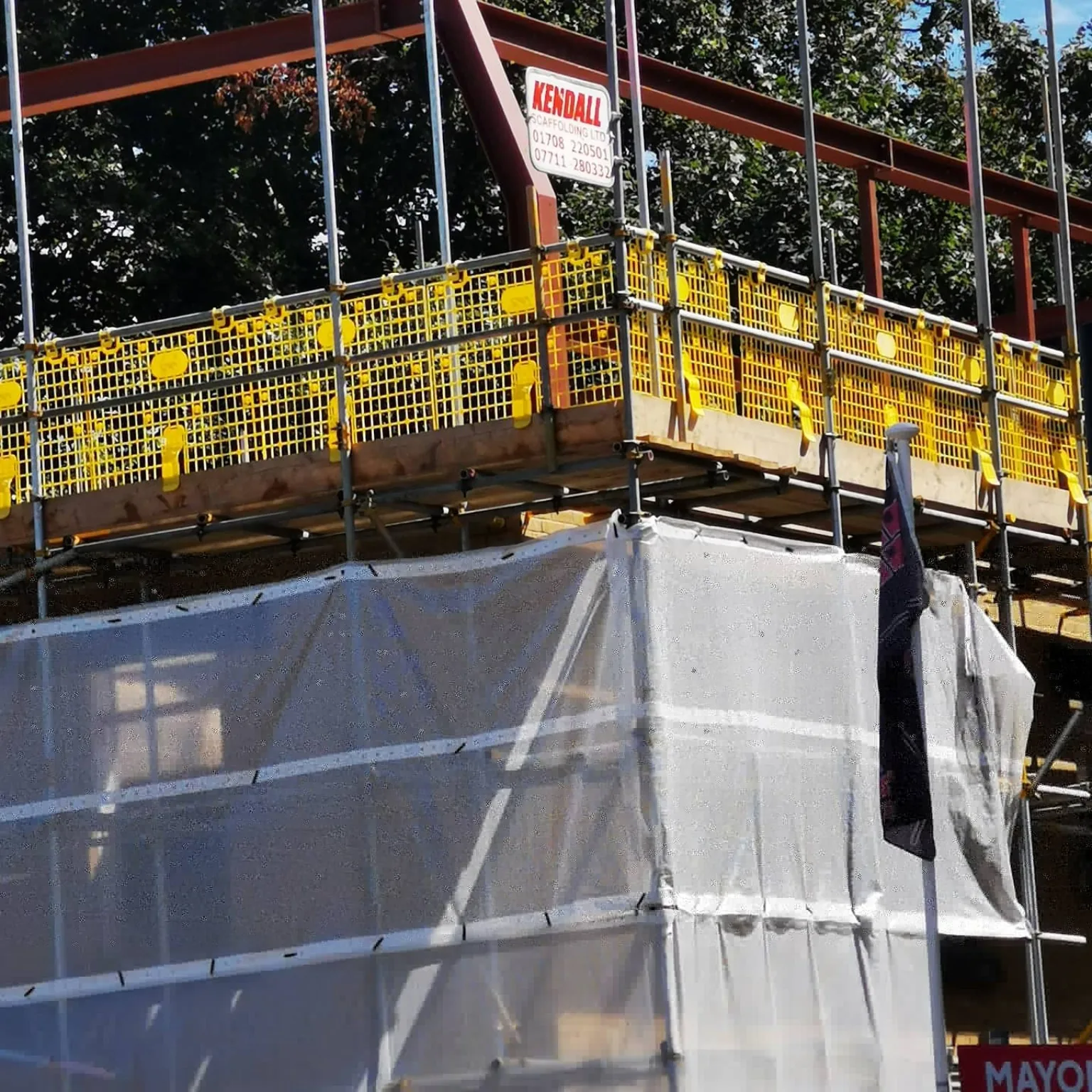 Scaffold access with yellow edge protection